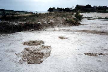 The view through the causewayed entrance toward the sea