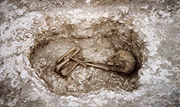 The child burial in the base of the ditch