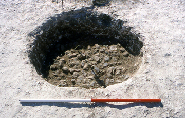 The circular pit containing a mass of burnt flint