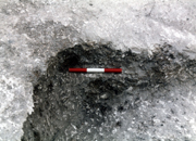 A small ledge cut at the western end of the grave