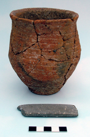 The 'Early Style' St. Peter's Beaker and stone wristguard