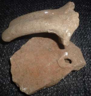 Medieval jug handle and peg tile sherd