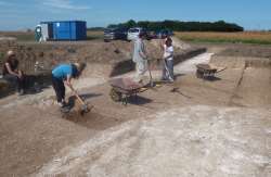 Excavating sections through the ring ditch
