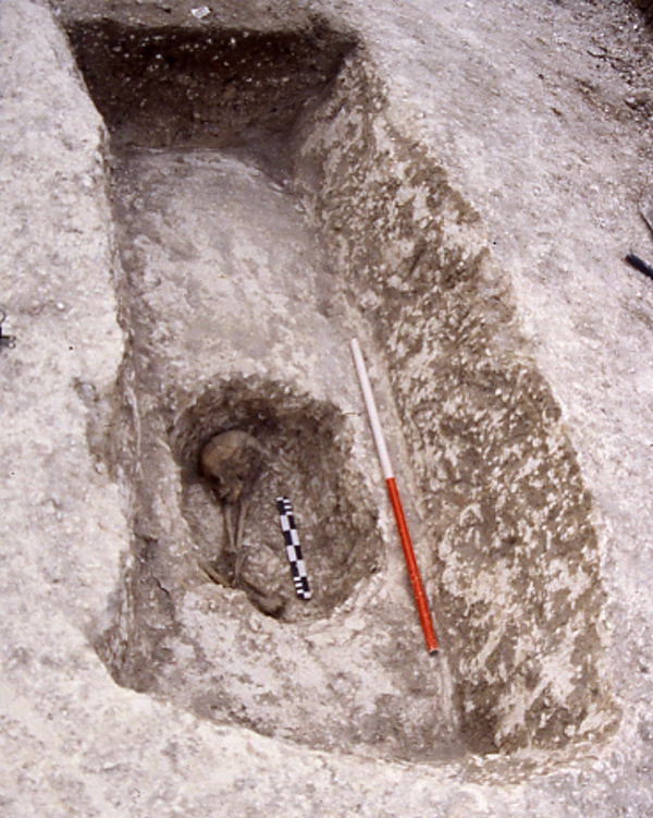Image of burial inserted into ditch of an Early Bronze Age round barrow